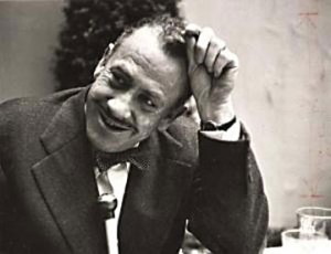 Image of John Steinbeck smiling for an audience