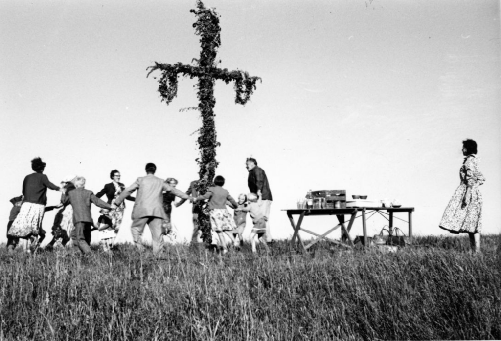Steinbeck dancing around at Midsommar celebration at Bo Beskow's farm in Sweden, 1957.